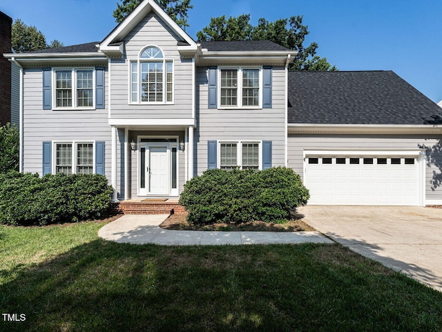 103 Glenstone Ln, Cary, NC 27518 - view of front facade with concrete driveway, a garage, a front yard, and roof with shingles