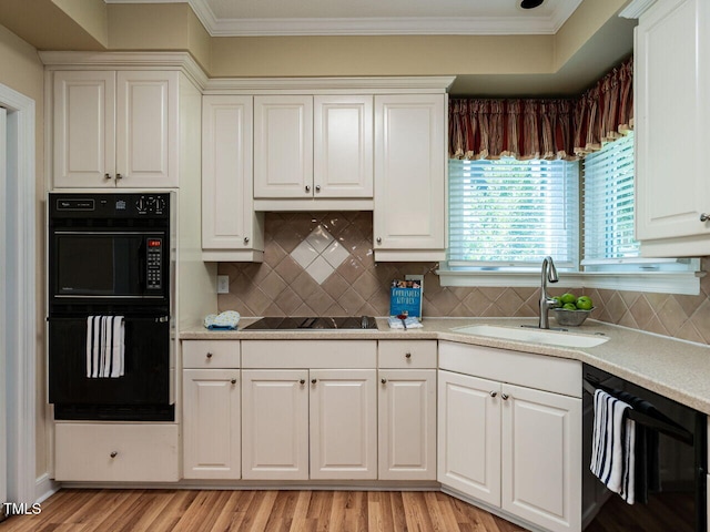 103 Glenstone Ln, Cary, NC 27518 - kitchen with black appliances, ornamental molding, light countertops, white cabinetry, and tasteful backsplash