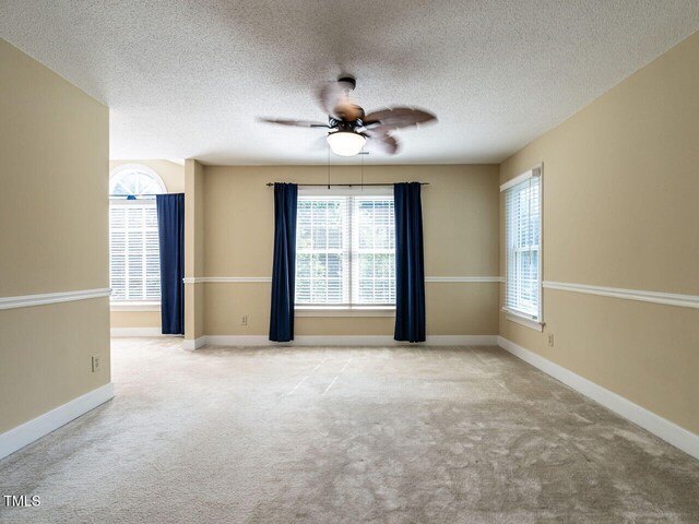 103 Glenstone Ln, Cary, NC 27518 - carpeted spare room with ceiling fan and a textured ceiling