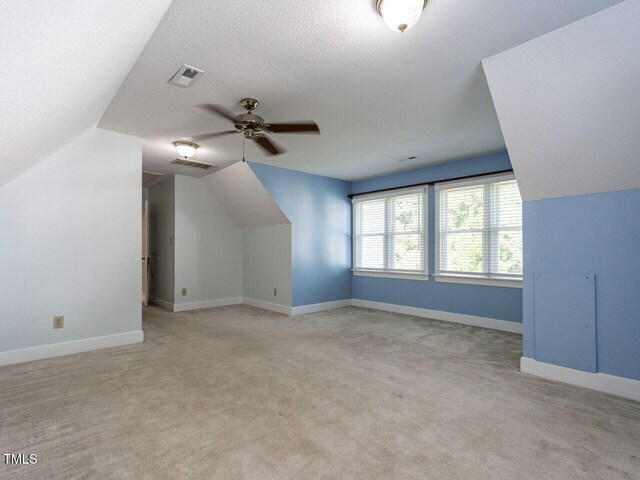 103 Glenstone Ln, Cary, NC 27518 - bonus room featuring vaulted ceiling, ceiling fan, light colored carpet, and a textured ceiling