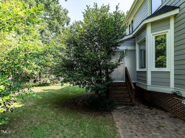 103 Glenstone Ln, Cary, NC 27518 - view of grassy yard featuring a patio