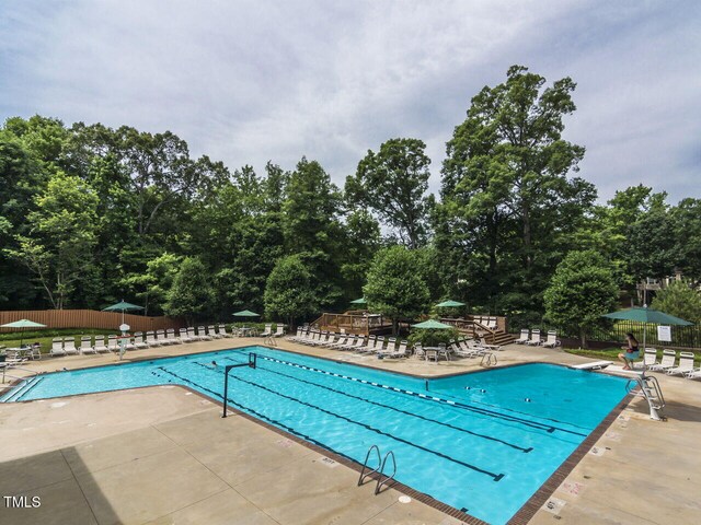 103 Glenstone Ln, Cary, NC 27518 - community pool with a patio area and view of wooded area