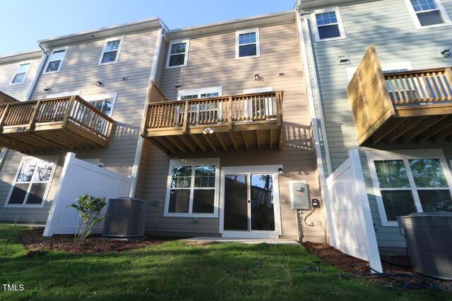 2721 Hunter Woods Dr # 565, Apex, NC 27502 - rear view of house featuring a balcony and a yard