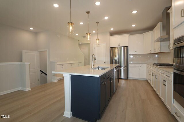 2721 Hunter Woods Dr # 565, Apex, NC 27502 - kitchen featuring stainless steel appliances, light countertops, light wood-type flooring, decorative backsplash, and white cabinetry