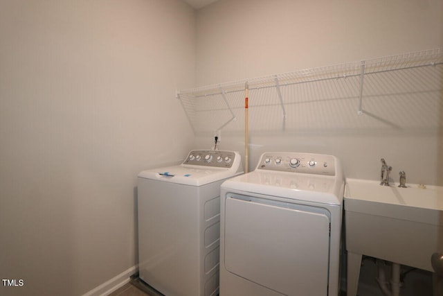 2721 Hunter Woods Dr # 565, Apex, NC 27502 - laundry room with washing machine and dryer and baseboards
