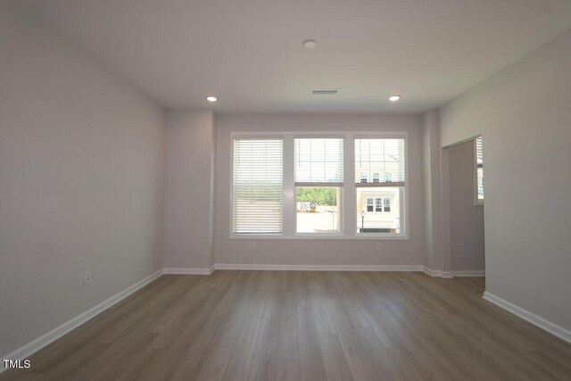 2721 Hunter Woods Dr # 565, Apex, NC 27502 - spare room with wood finished floors and recessed lighting