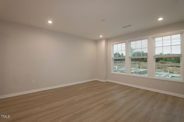 2721 Hunter Woods Dr # 565, Apex, NC 27502 - unfurnished room featuring light wood-style floors and recessed lighting