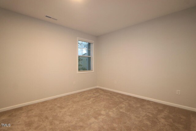 2721 Hunter Woods Dr # 565, Apex, NC 27502 - spare room with carpet and baseboards