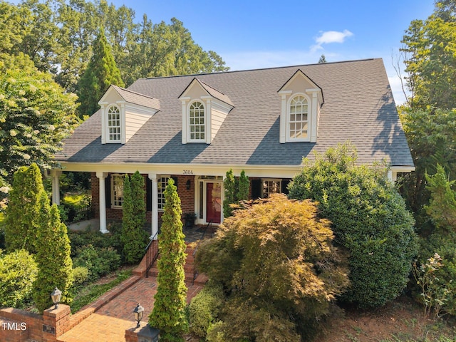 3604 Eden Croft Dr, Raleigh, NC 27612 - new england style home with roof with shingles and brick siding