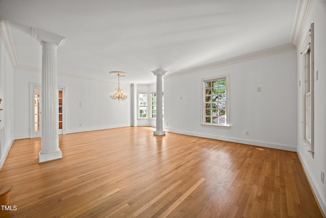 3604 Eden Croft Dr, Raleigh, NC 27612 - unfurnished living room with decorative columns, crown molding, light wood-style flooring, and a chandelier