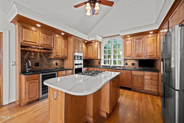 3604 Eden Croft Dr, Raleigh, NC 27612 - kitchen featuring wine cooler, brown cabinets, light wood-style flooring, stainless steel appliances, and ceiling fan