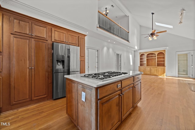 3604 Eden Croft Dr, Raleigh, NC 27612 - kitchen featuring high vaulted ceiling, brown cabinetry, stainless steel fridge, light wood-type flooring, and ceiling fan