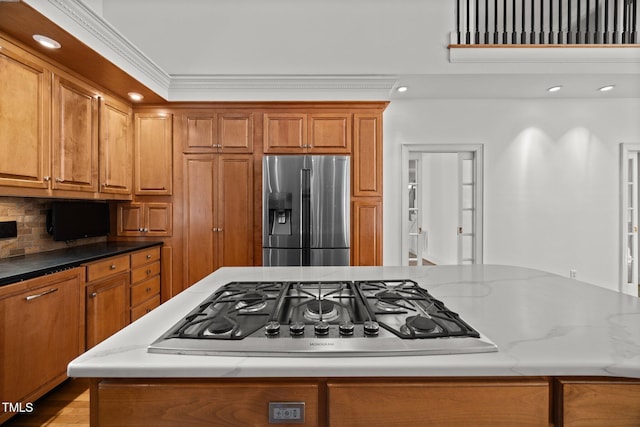 3604 Eden Croft Dr, Raleigh, NC 27612 - kitchen featuring stainless steel appliances, brown cabinets, light stone countertops, backsplash, and recessed lighting