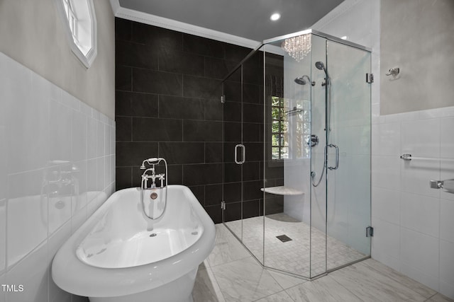 3604 Eden Croft Dr, Raleigh, NC 27612 - bathroom featuring tile walls, a freestanding tub, healthy amount of natural light, a shower stall, and ornamental molding