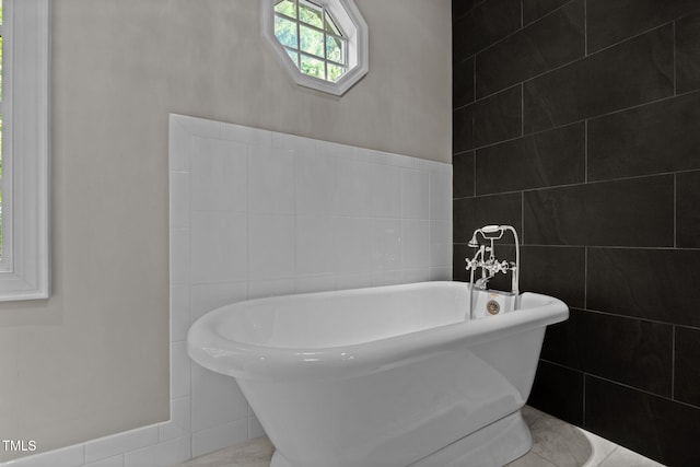 3604 Eden Croft Dr, Raleigh, NC 27612 - bathroom with a freestanding tub and tile walls