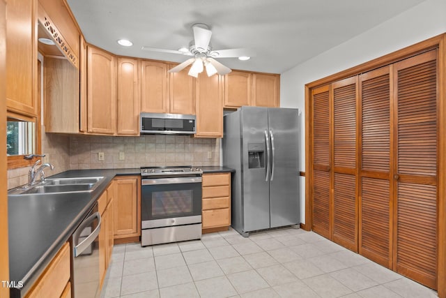 12501 Hardee Rd, Raleigh, NC 27614 - kitchen featuring stainless steel appliances, dark countertops, decorative backsplash, a ceiling fan, and light brown cabinetry