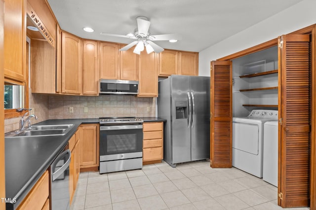 12501 Hardee Rd, Raleigh, NC 27614 - kitchen with appliances with stainless steel finishes, washer and dryer, dark countertops, ceiling fan, and decorative backsplash