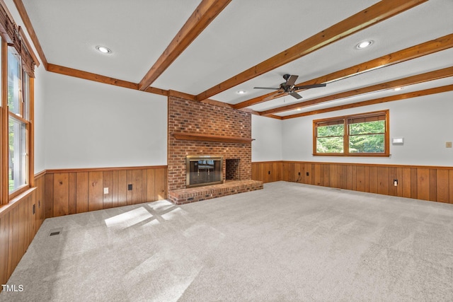 12501 Hardee Rd, Raleigh, NC 27614 - unfurnished living room featuring wainscoting, wooden walls, beamed ceiling, ceiling fan, and recessed lighting