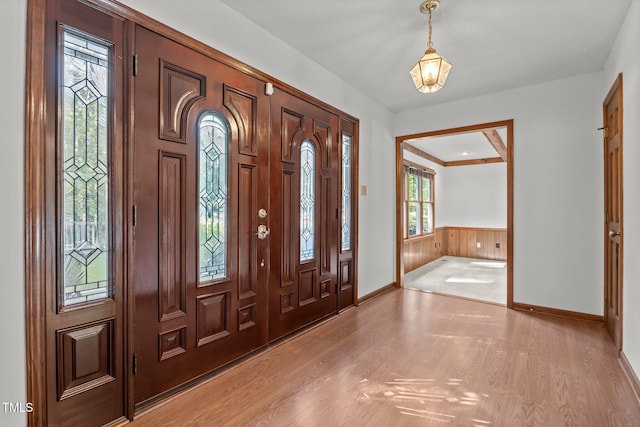 12501 Hardee Rd, Raleigh, NC 27614 - entrance foyer with light wood-type flooring and a wainscoted wall