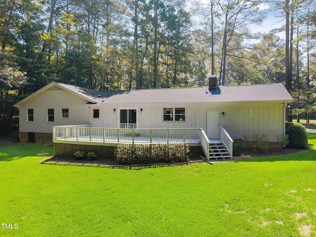 12501 Hardee Rd, Raleigh, NC 27614 - rear view of house featuring a chimney, a lawn, a wooden deck, and a shingled roof