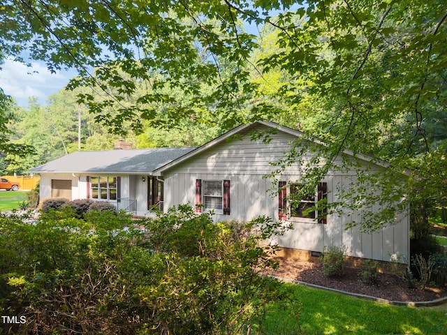 12501 Hardee Rd, Raleigh, NC 27614 - ranch-style home featuring an attached garage, board and batten siding, and crawl space