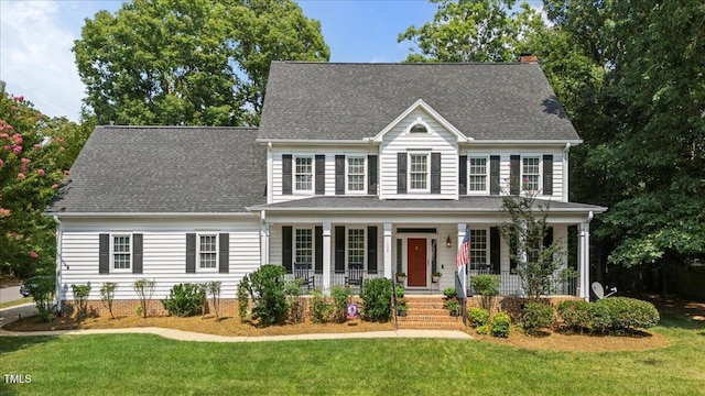 102 Barometer Ln, Cary, NC 27513 - colonial home with covered porch, a front lawn, and roof with shingles