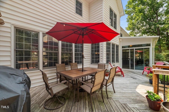 102 Barometer Ln, Cary, NC 27513 - wooden terrace with outdoor dining space, a sunroom, and a grill