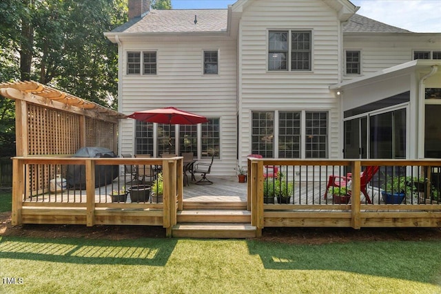 102 Barometer Ln, Cary, NC 27513 - back of property featuring a chimney, a shingled roof, a wooden deck, and a lawn