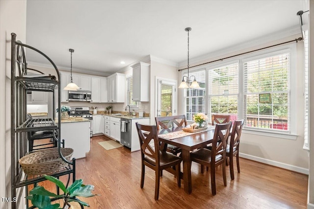 102 Barometer Ln, Cary, NC 27513 - dining room featuring crown molding, light wood-style floors, and recessed lighting