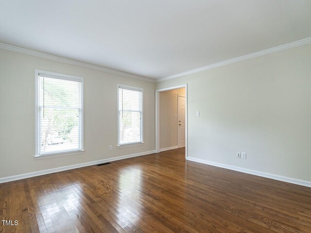 4032 Brook Cross Dr, Apex, NC 27539 - empty room featuring ornamental molding and dark wood-style flooring