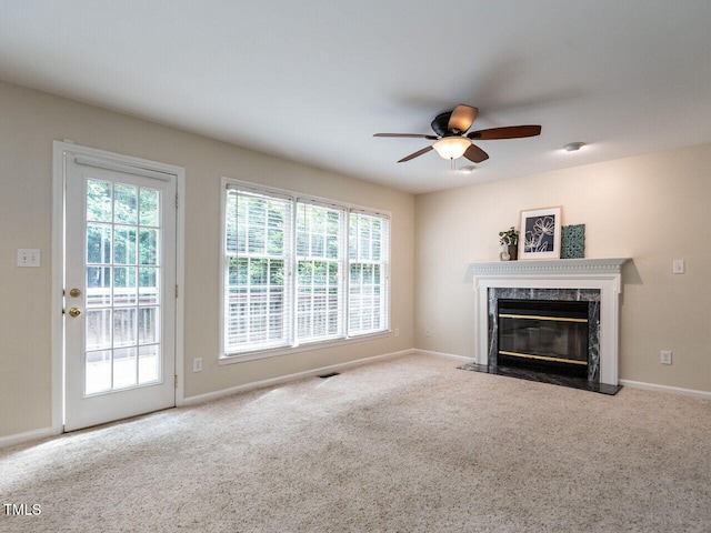 4032 Brook Cross Dr, Apex, NC 27539 - unfurnished living room featuring a ceiling fan, healthy amount of natural light, and carpet flooring