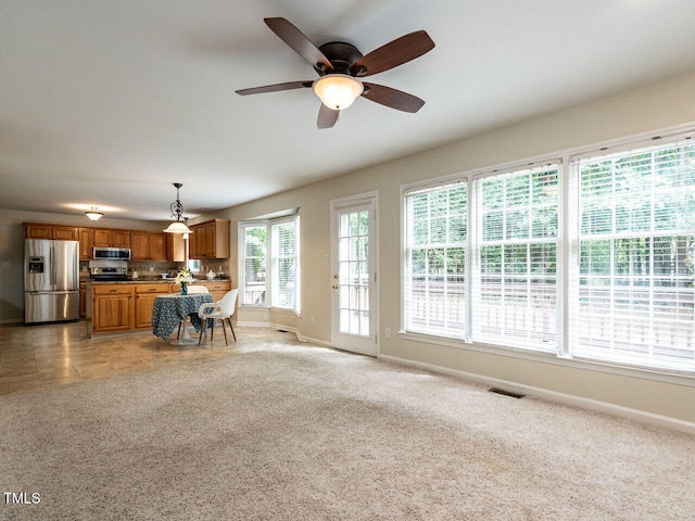 4032 Brook Cross Dr, Apex, NC 27539 - living area featuring ceiling fan and light colored carpet