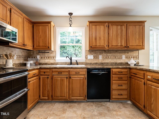 4032 Brook Cross Dr, Apex, NC 27539 - kitchen with appliances with stainless steel finishes, healthy amount of natural light, brown cabinetry, and dark countertops
