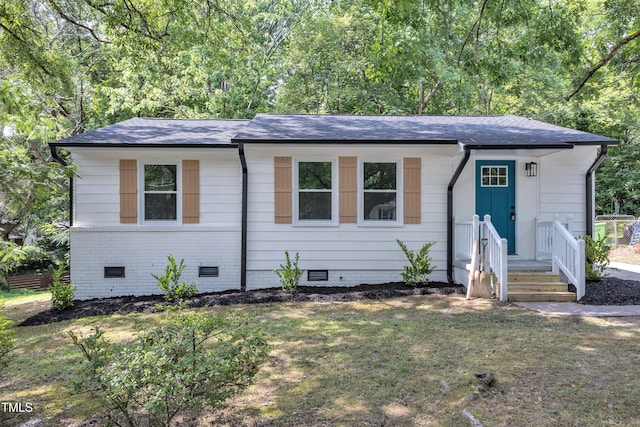 2408 Glascock St, Raleigh, NC 27610 - view of front facade with crawl space, roof with shingles, and a front lawn