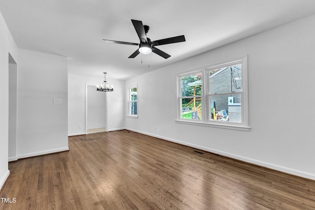 2408 Glascock St, Raleigh, NC 27610 - unfurnished room with a chandelier, wood finished floors, and a ceiling fan
