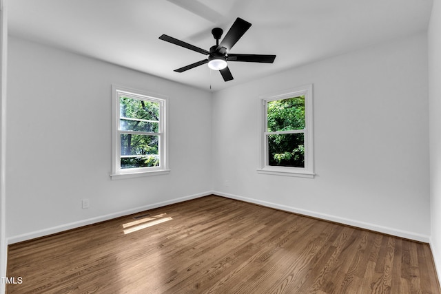 2408 Glascock St, Raleigh, NC 27610 - spare room featuring healthy amount of natural light, wood finished floors, and a ceiling fan
