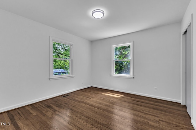2408 Glascock St, Raleigh, NC 27610 - spare room with plenty of natural light and dark wood-style flooring