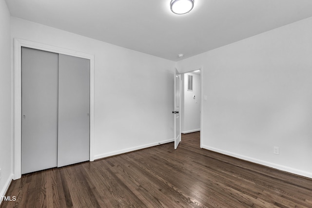 2408 Glascock St, Raleigh, NC 27610 - unfurnished bedroom with wood finished floors and a closet