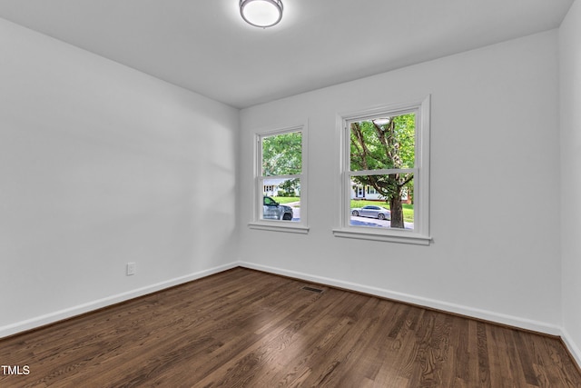 2408 Glascock St, Raleigh, NC 27610 - spare room with baseboards and dark wood-style floors