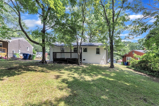 2408 Glascock St, Raleigh, NC 27610 - back of house with a yard and a wooden deck