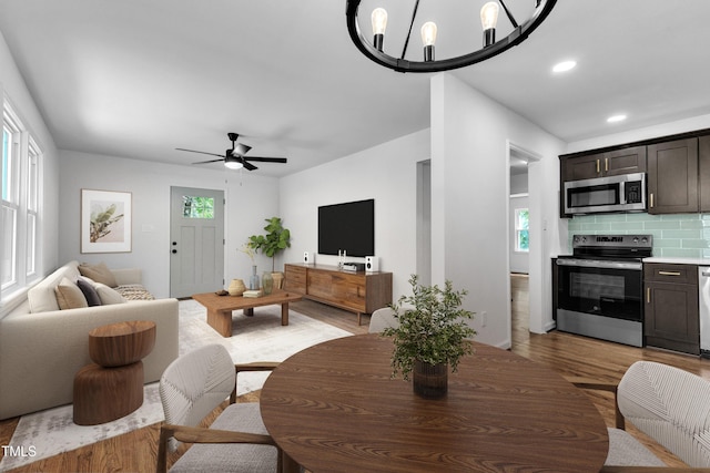 2408 Glascock St, Raleigh, NC 27610 - living area featuring light wood finished floors, ceiling fan, and recessed lighting