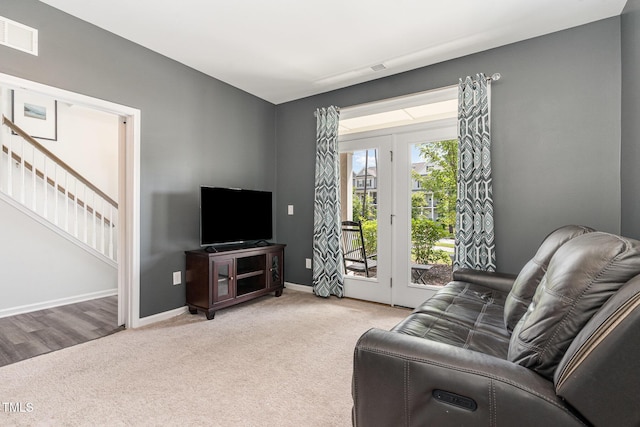 1425 Herb Garden Way, Apex, NC 27502 - carpeted living area featuring baseboards and stairs