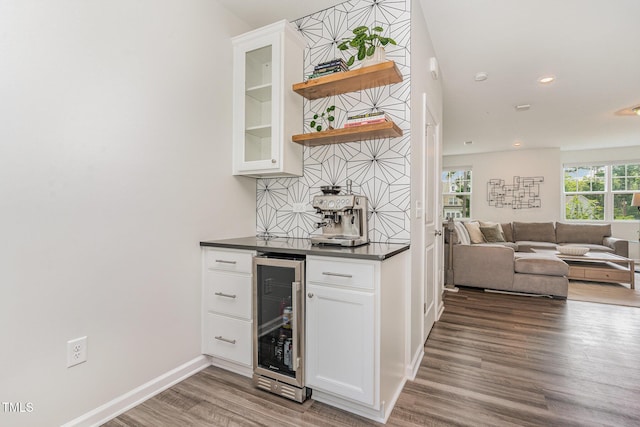 1425 Herb Garden Way, Apex, NC 27502 - indoor dry bar with wine cooler, wood finished floors, tasteful backsplash, and recessed lighting