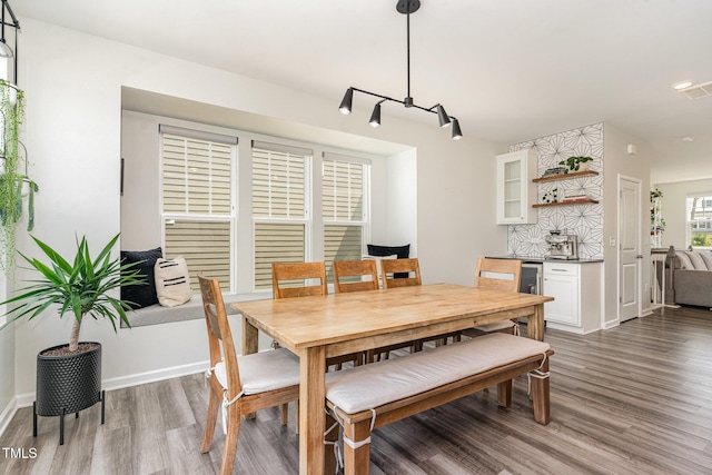 1425 Herb Garden Way, Apex, NC 27502 - dining space with wood finished floors and wine cooler