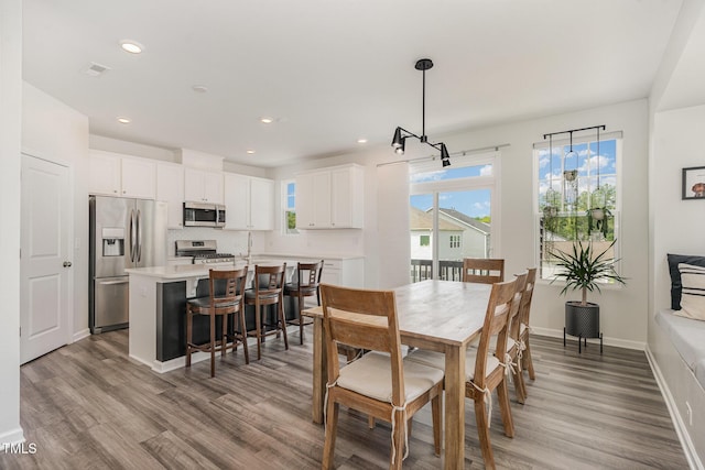 1425 Herb Garden Way, Apex, NC 27502 - dining room with wood finished floors and recessed lighting