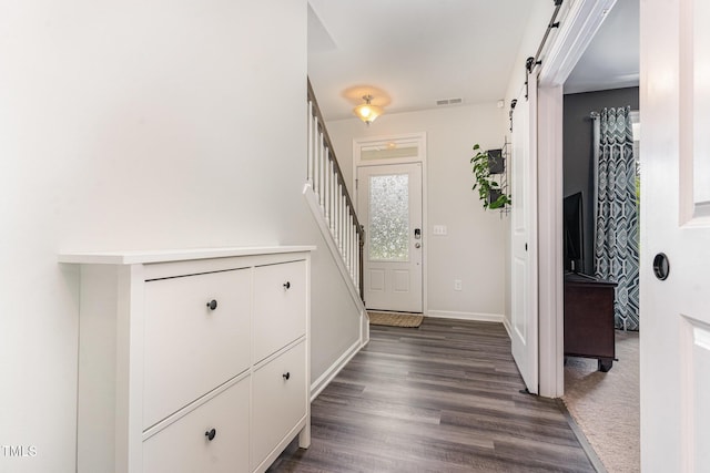 1425 Herb Garden Way, Apex, NC 27502 - foyer entrance with a barn door, dark wood-style flooring, and stairway