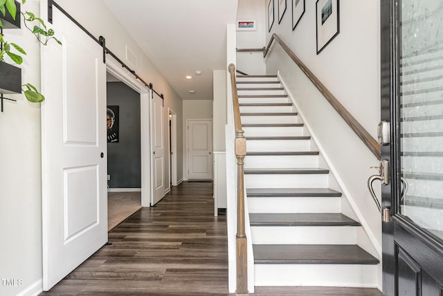 1425 Herb Garden Way, Apex, NC 27502 - staircase with a barn door, recessed lighting, and wood finished floors