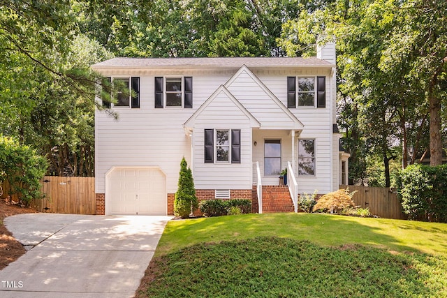 114 Dalmeny Dr, Cary, NC 27513 - traditional-style home with a chimney, driveway, and an attached garage