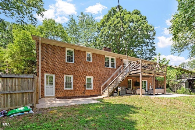 1920 Quail Ridge Rd, Raleigh, NC 27609 - rear view of property featuring a patio area, stairway, a deck, and a chimney