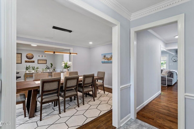 1920 Quail Ridge Rd, Raleigh, NC 27609 - dining room with wood finished floors, crown molding, and recessed lighting